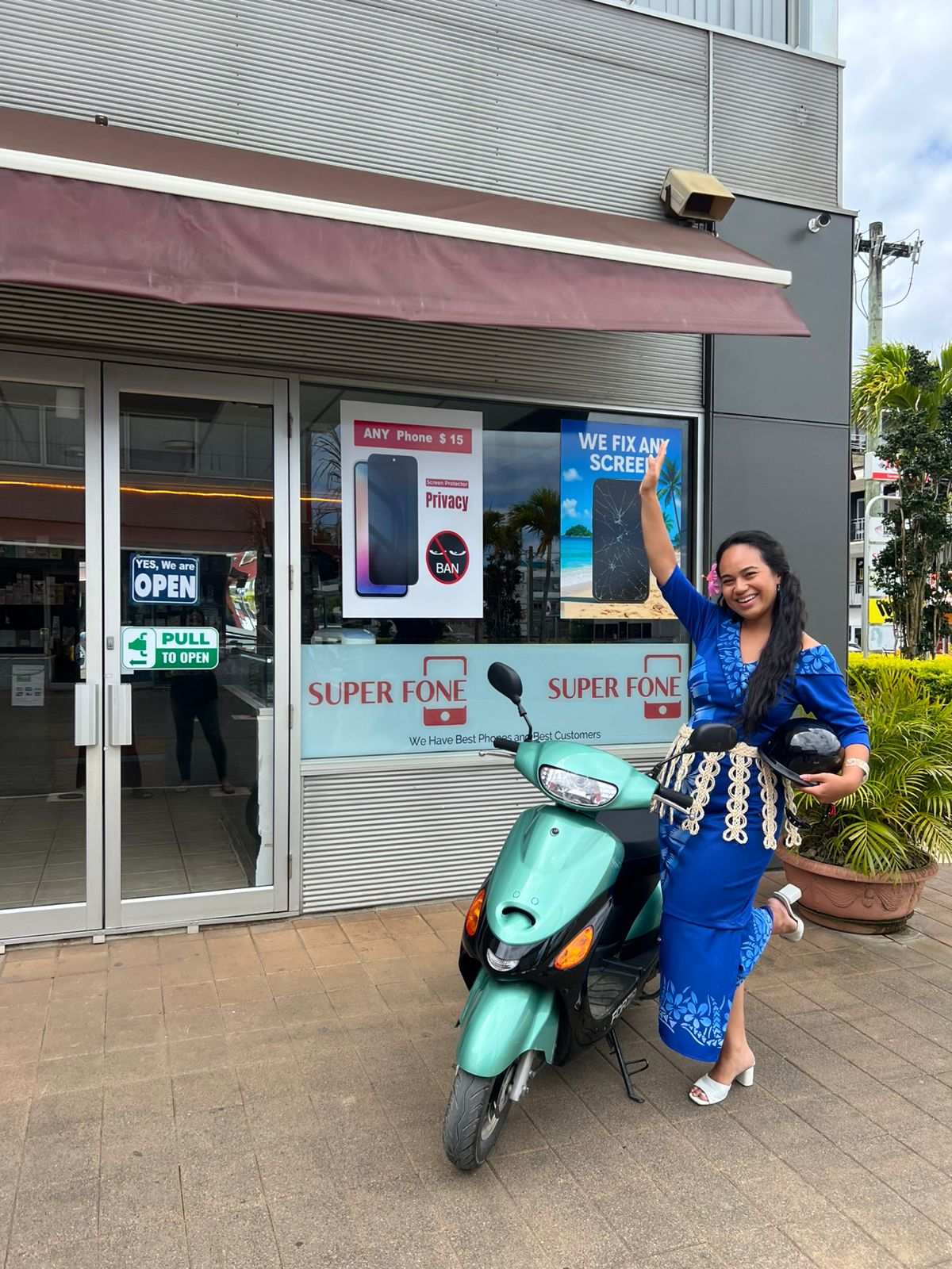 Heilala with a scooter at Super Fone